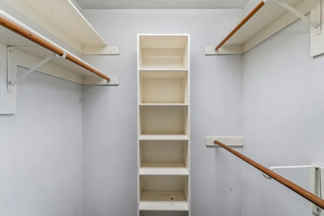 a view of an empty walk in closet