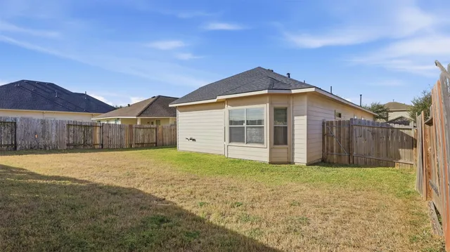 a picture of a bathroom with a shower