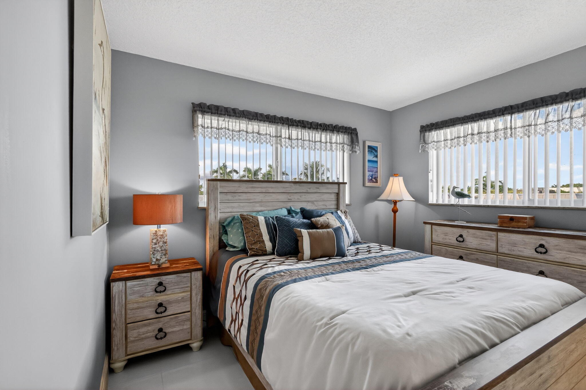 12 Colonial Club Drive, Unit 305 Boynton Beach, FL 33435 - Photo 12 of 51 a bedroom with a bed and a window