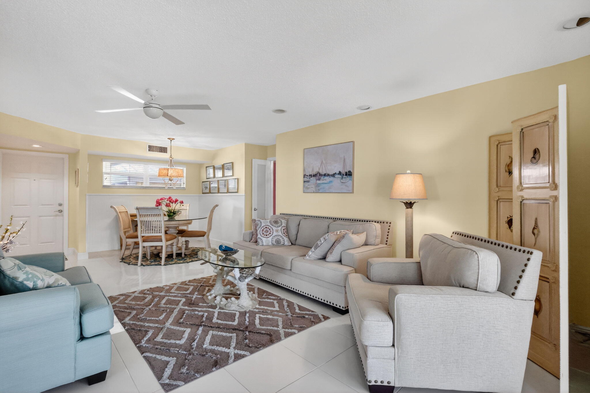 12 Colonial Club Drive, Unit 305 Boynton Beach, FL 33435 - Photo 13 of 51 a living room with furniture a table and a potted plant