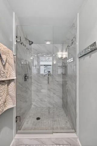 a en suite bathroom with a double vanity sink and a mirror