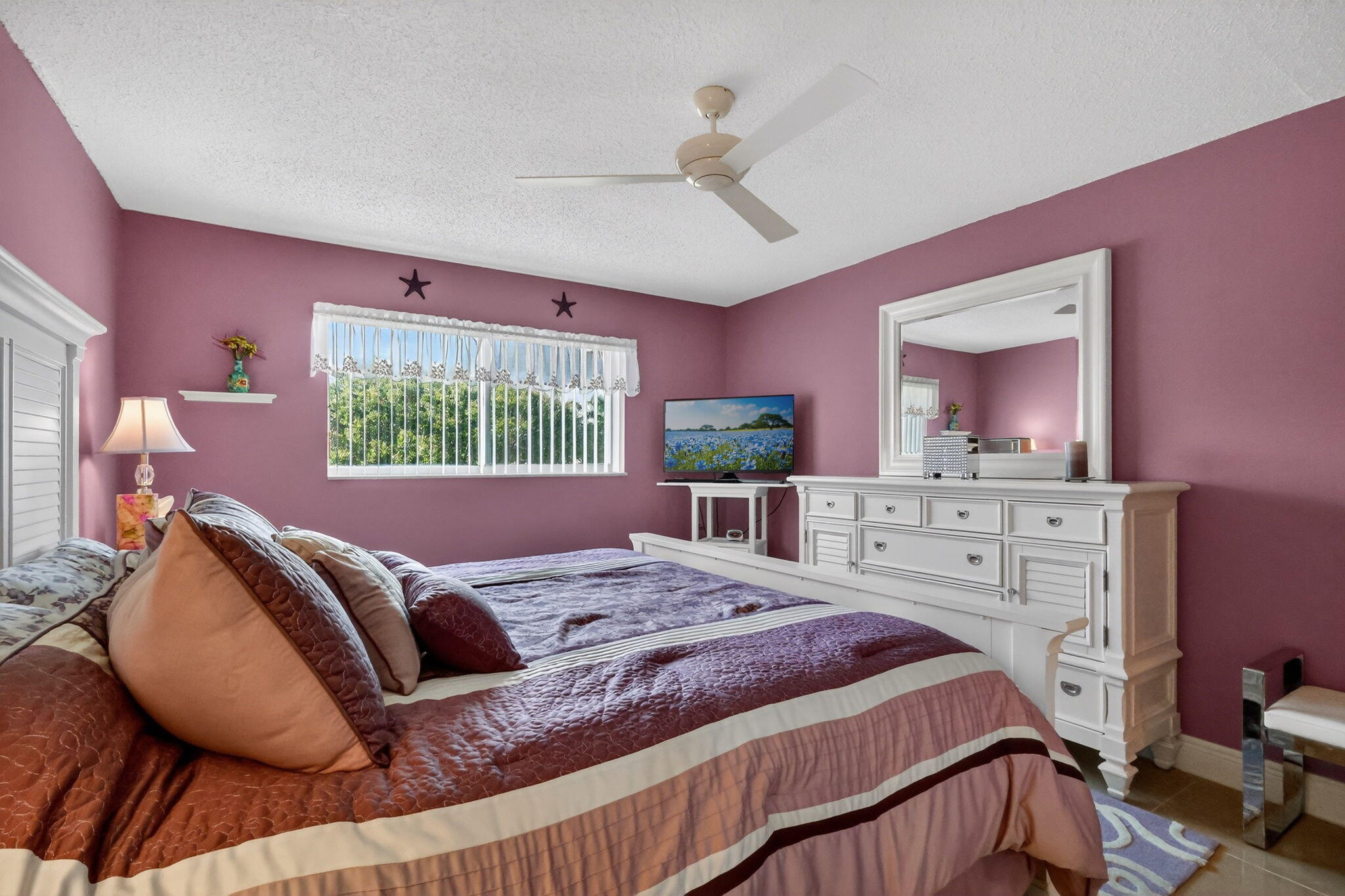 12 Colonial Club Drive, Unit 305 Boynton Beach, FL 33435 - Photo 21 of 51 a bedroom with a large bed and a window