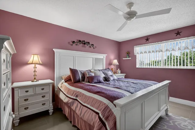 a bedroom with a bed and a dresser in it