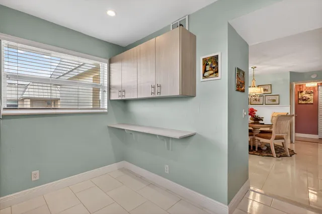 an aerial view of a house with garden space and outdoor seating