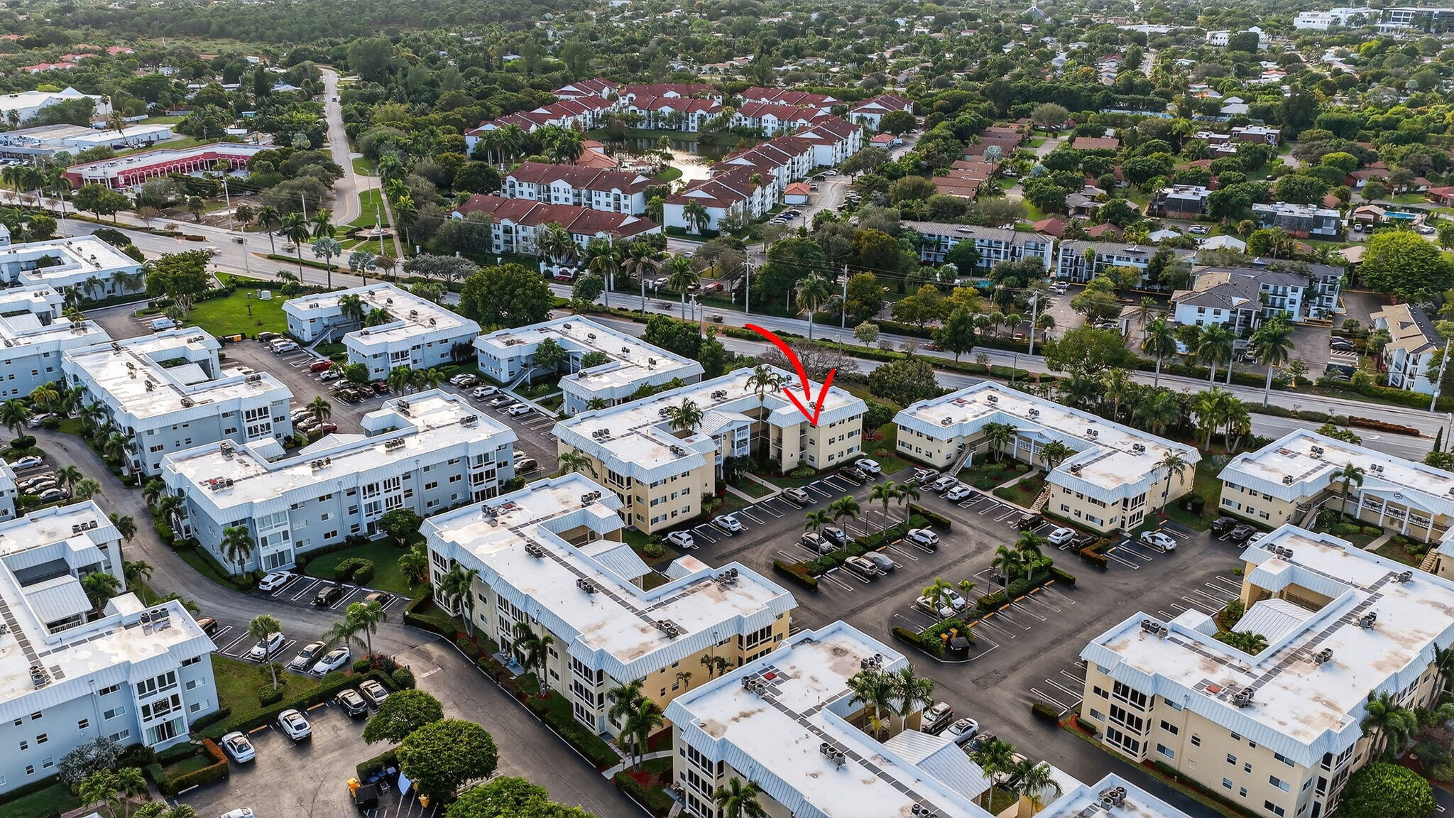 12 Colonial Club Drive, Unit 305 Boynton Beach, FL 33435 - Photo 40 of 51 an aerial view of a city with lots of residential buildings