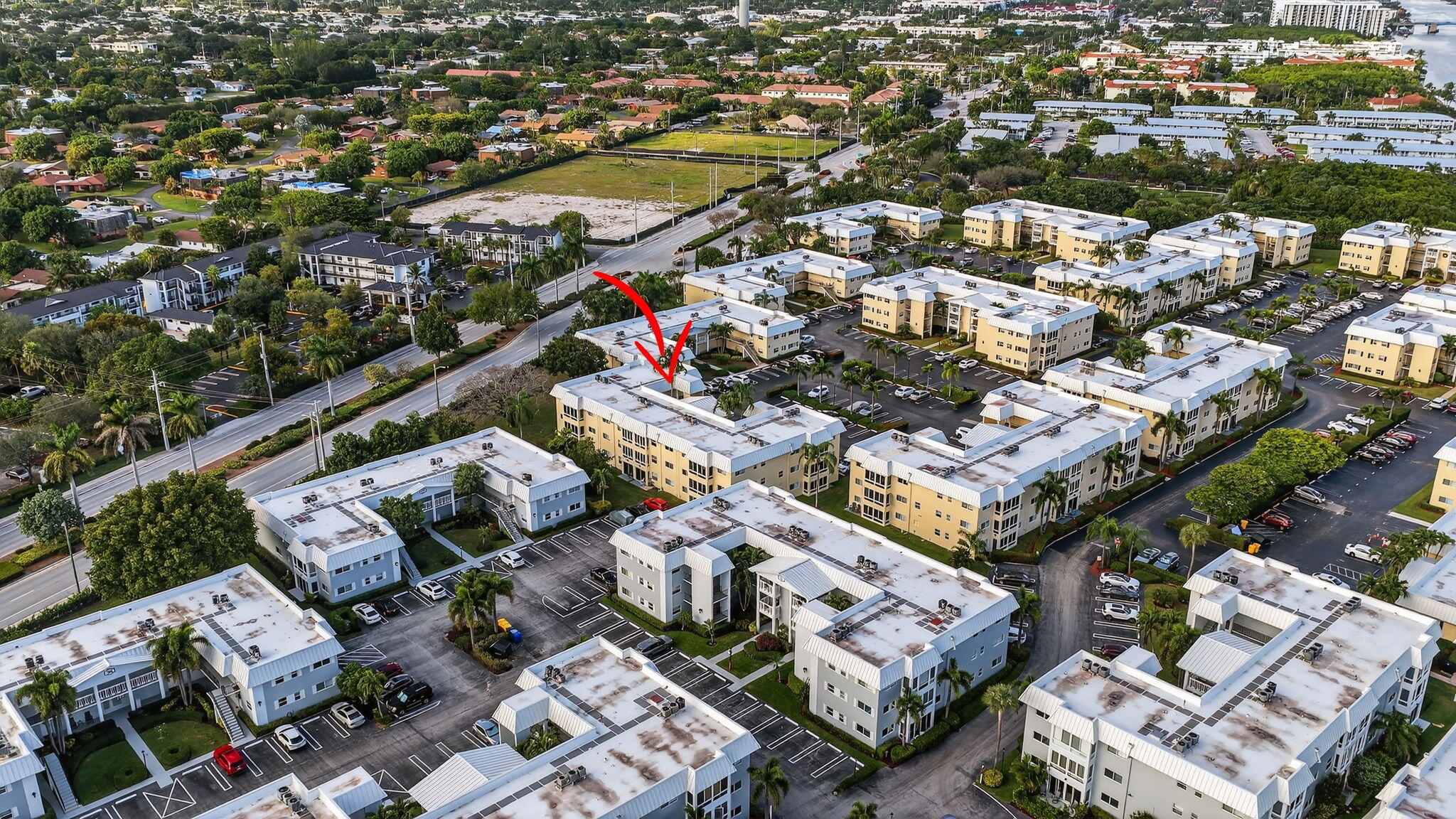 12 Colonial Club Drive, Unit 305 Boynton Beach, FL 33435 - Photo 42 of 51 an aerial view of a city with lots of residential buildings
