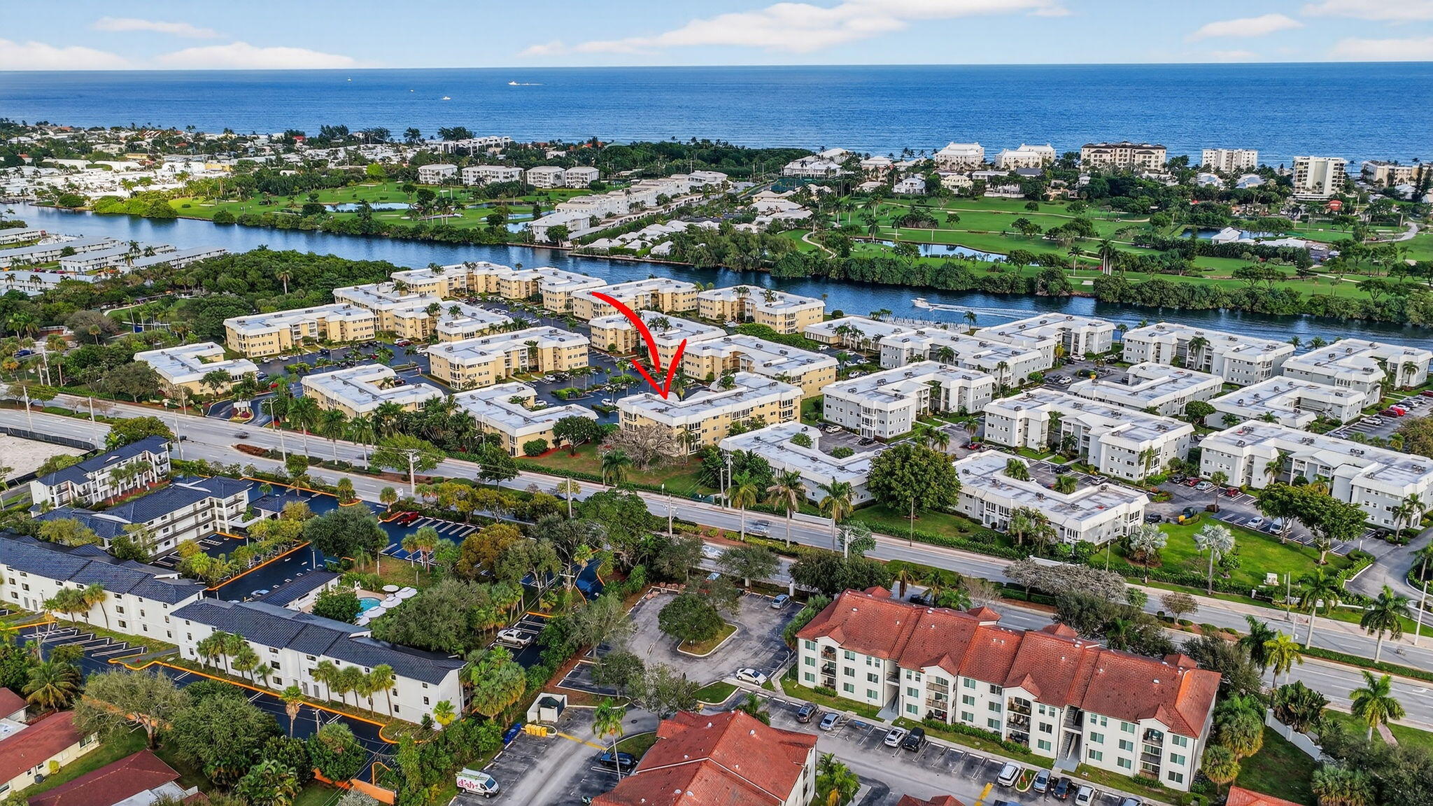 12 Colonial Club Drive, Unit 305 Boynton Beach, FL 33435 - Photo 45 of 51 an aerial view of a city with lots of residential buildings ocean and mountain view in back
