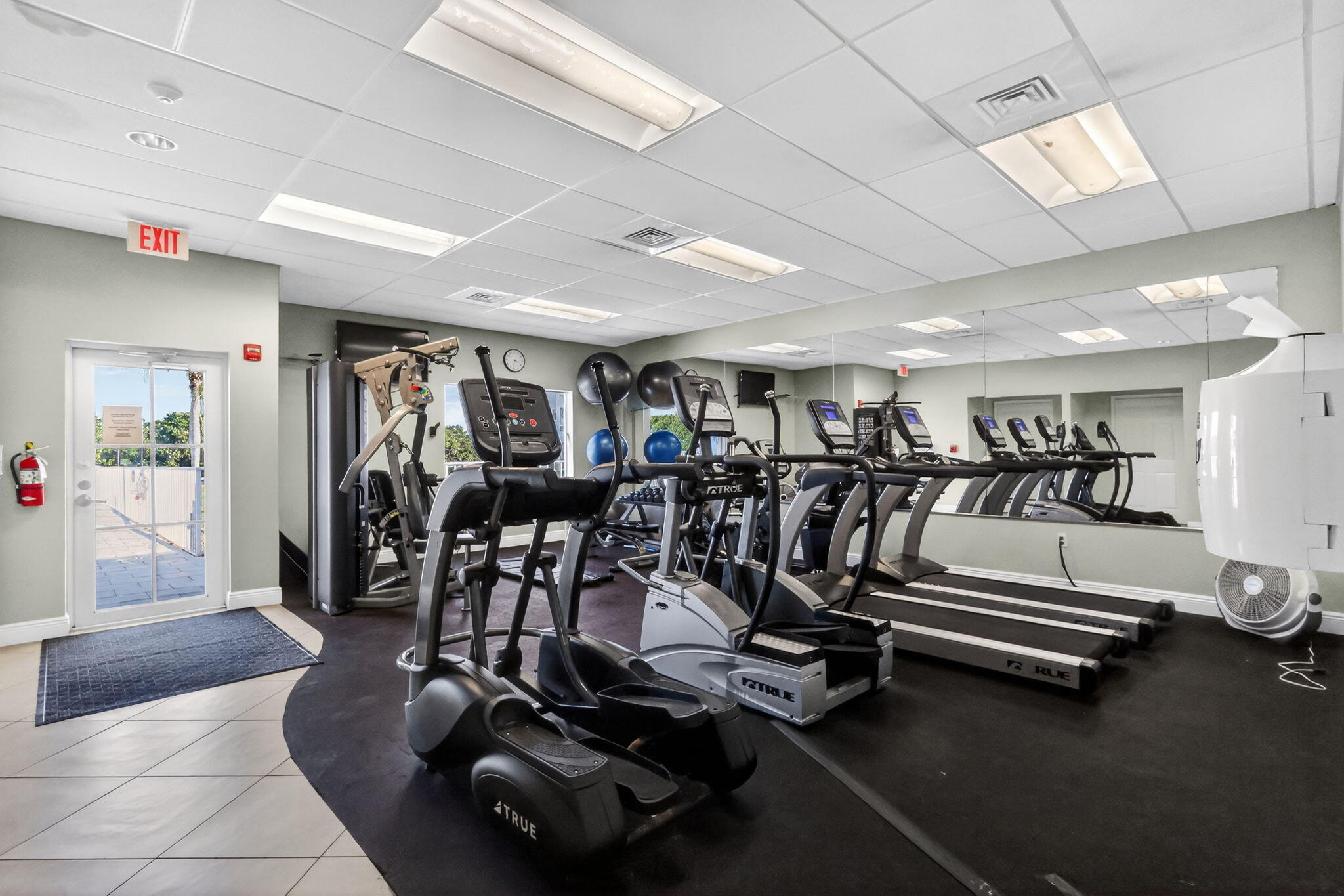 12 Colonial Club Drive, Unit 305 Boynton Beach, FL 33435 - Photo 46 of 51 a view of a room with gym equipment