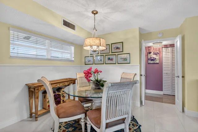 a living room with furniture a large window and a flat screen tv