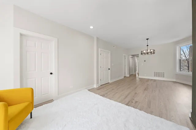 a living room with a flat screen tv and a fireplace