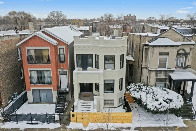 an aerial view of residential houses with outdoor space