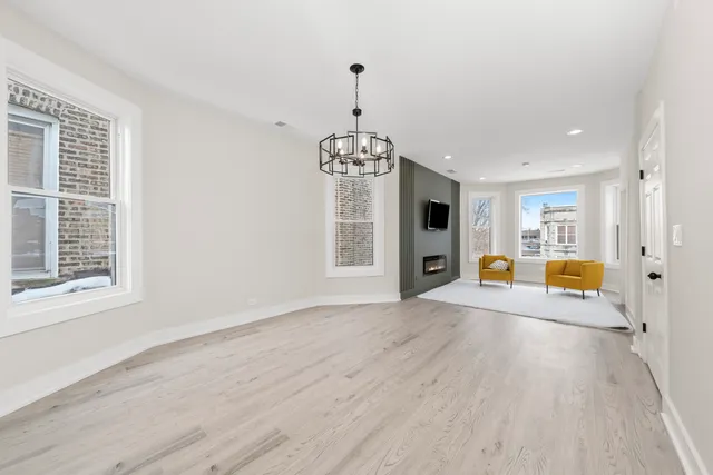 a view of livingroom with hardwood floor and hallway