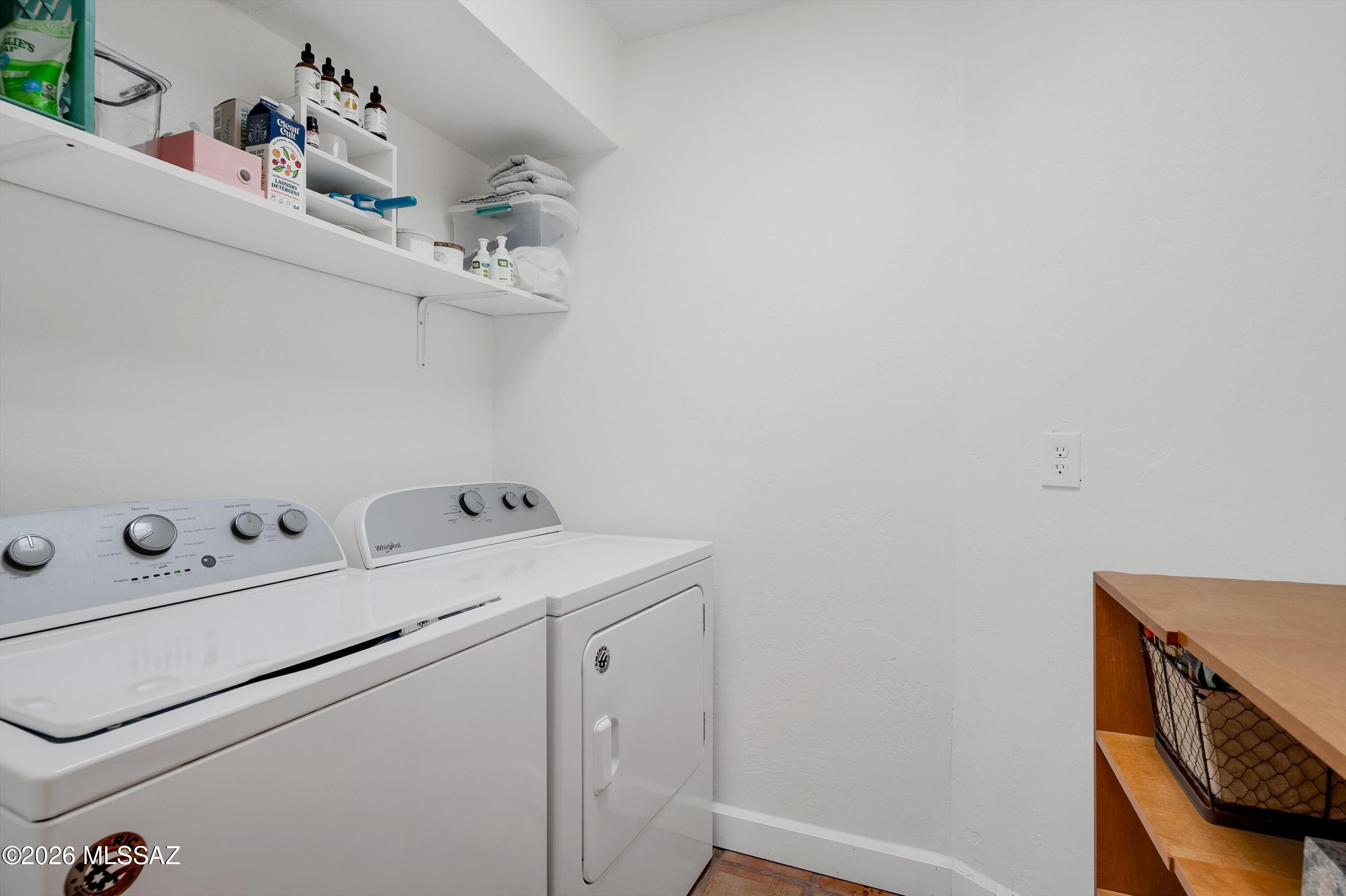 6941 East Rivercrest Road Tucson, AZ 85750 - Photo 16 of 32 a utility room with dryer and washer