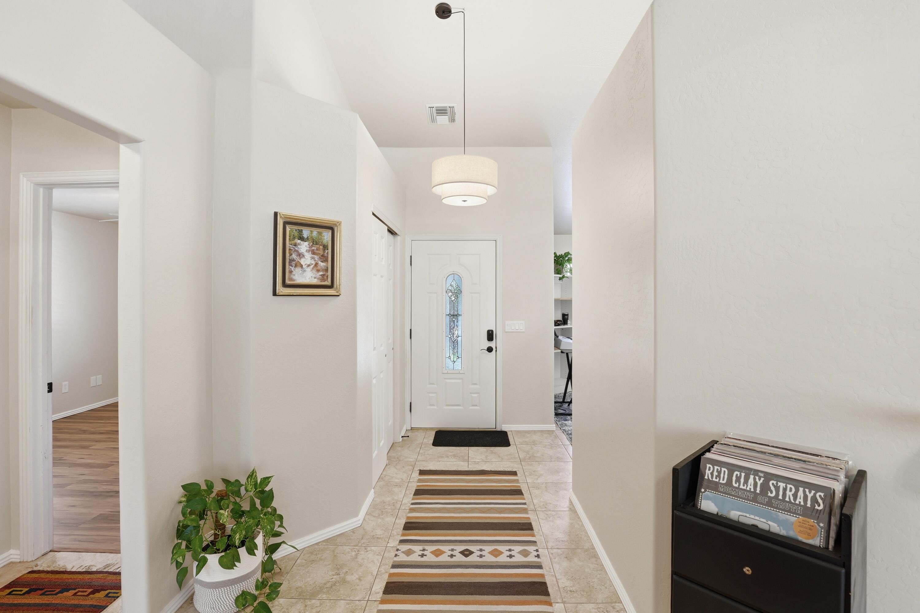 910 West Wagon Trail Payson, AZ 85541 - Photo 11 of 35 a view of a hallway with wooden floor and a potted plant