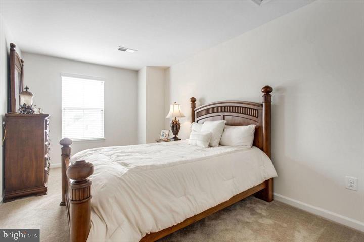 41663 McMonagle Square Aldie, VA 20105 - Photo 16 of 22 a bedroom with a bed and a window