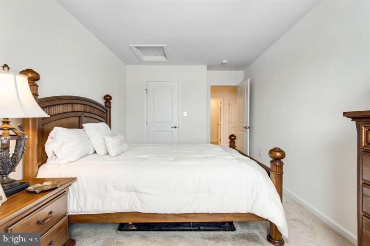 41663 McMonagle Square Aldie, VA 20105 - Photo 17 of 22 a bedroom with a bed and a window