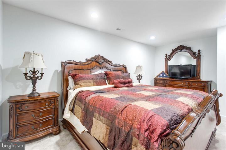 41663 McMonagle Square Aldie, VA 20105 - Photo 21 of 22 a bedroom with a bed and a dresser