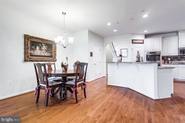 41663 McMonagle Square Aldie, VA 20105 - Photo 8 of 22 a dining room with furniture and wooden floor