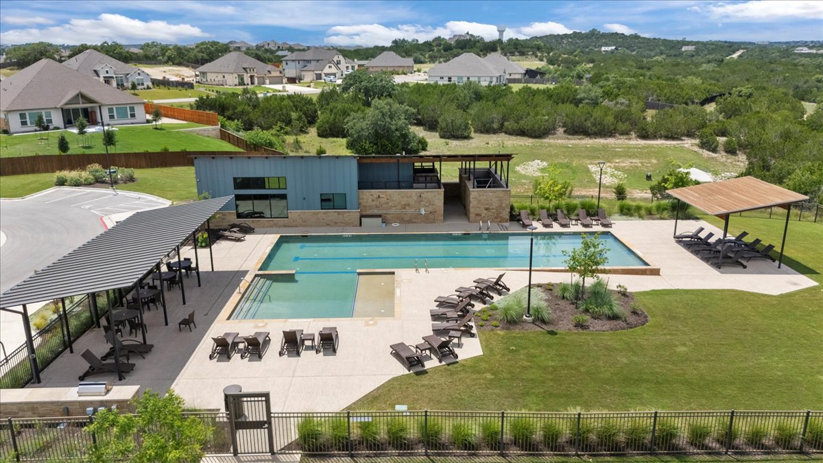 271 Eclipse Drive Austin, TX 78737 - Photo 35 of 39 Community pool with a patio area and a residential view