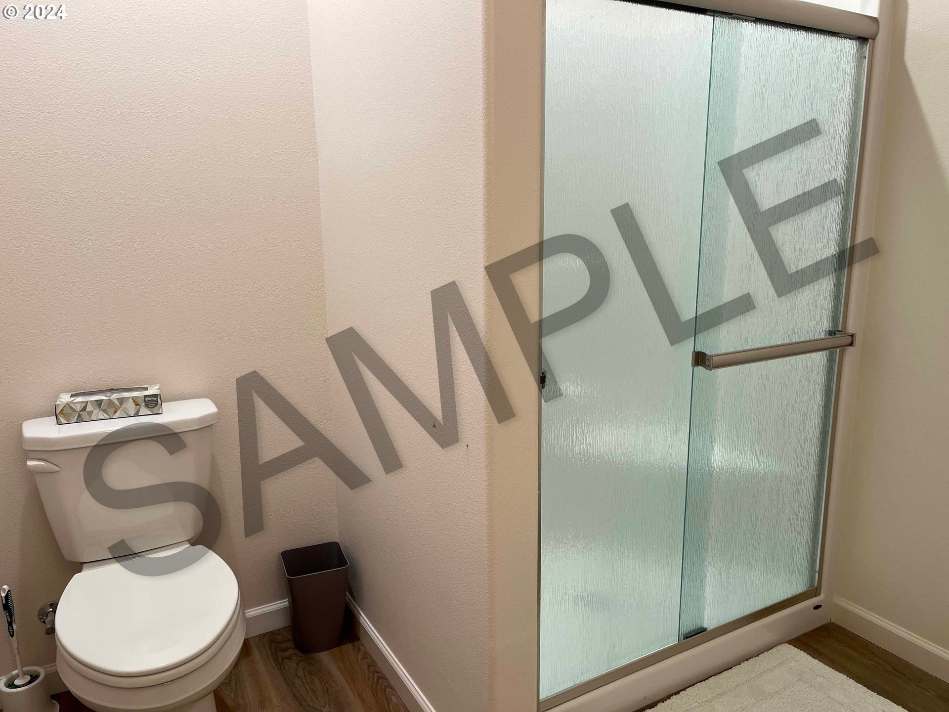 1591 37th Street Florence, OR 97439 - Photo 33 of 48 a white toilet sitting next to a bathroom sink