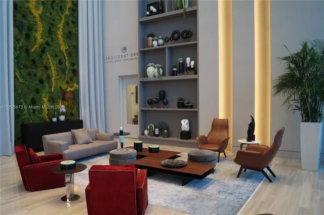 a living room with furniture and a potted plant