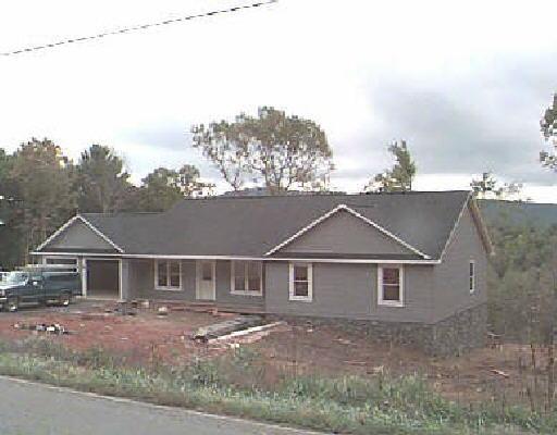 a view of house with outdoor space