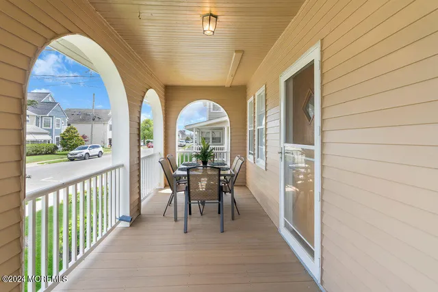 a view of a patio with a table and chairs