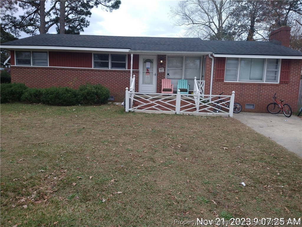 206 Kimbrough Road Clinton, NC 28328 - Photo 1 of 3 a view of a house with a patio and a yard