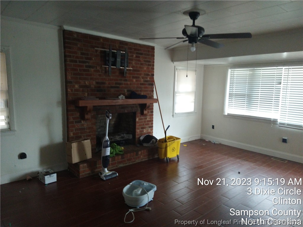 206 Kimbrough Road Clinton, NC 28328 - Photo 3 of 3 a living room with furniture and a fireplace