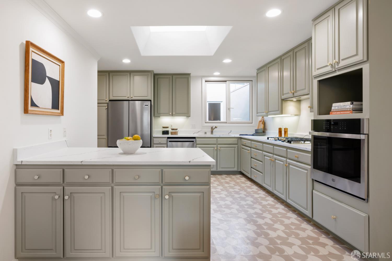 1768 Jackson Street San Francisco, CA 94109 - Photo 13 of 33 a kitchen with granite countertop white cabinets and stainless steel appliances