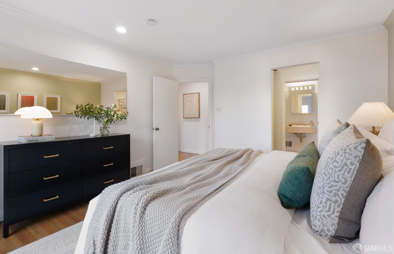 1768 Jackson Street San Francisco, CA 94109 - Photo 16 of 33 a bedroom with a bed and a mirror on dresser