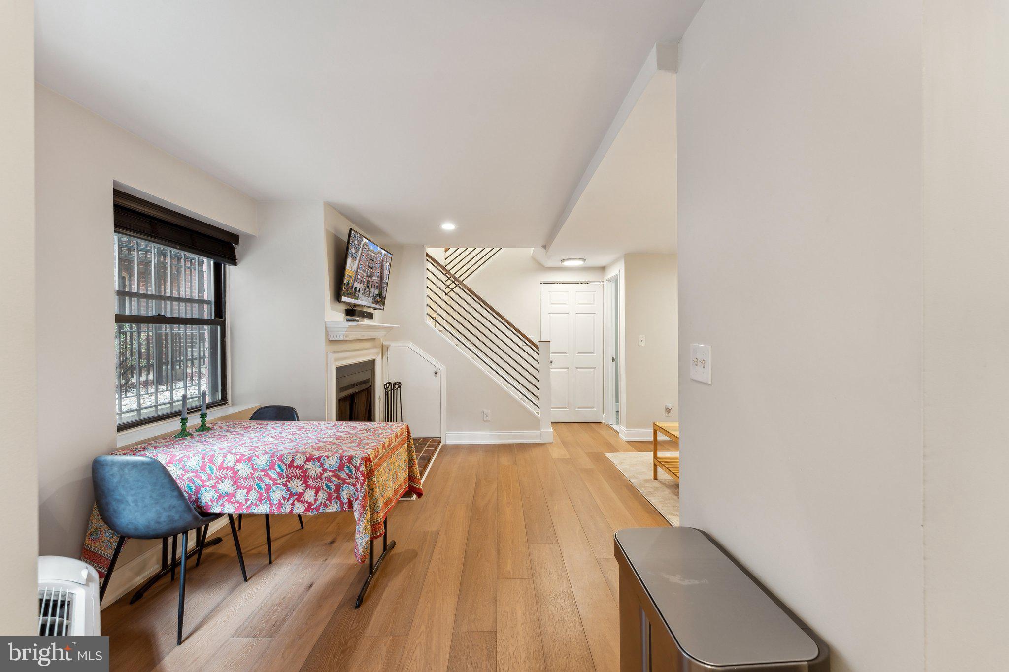 1844 Columbia Road Northwest, Unit 103 Washington, DC 20009 - Photo 19 of 21 a living room with furniture and a table