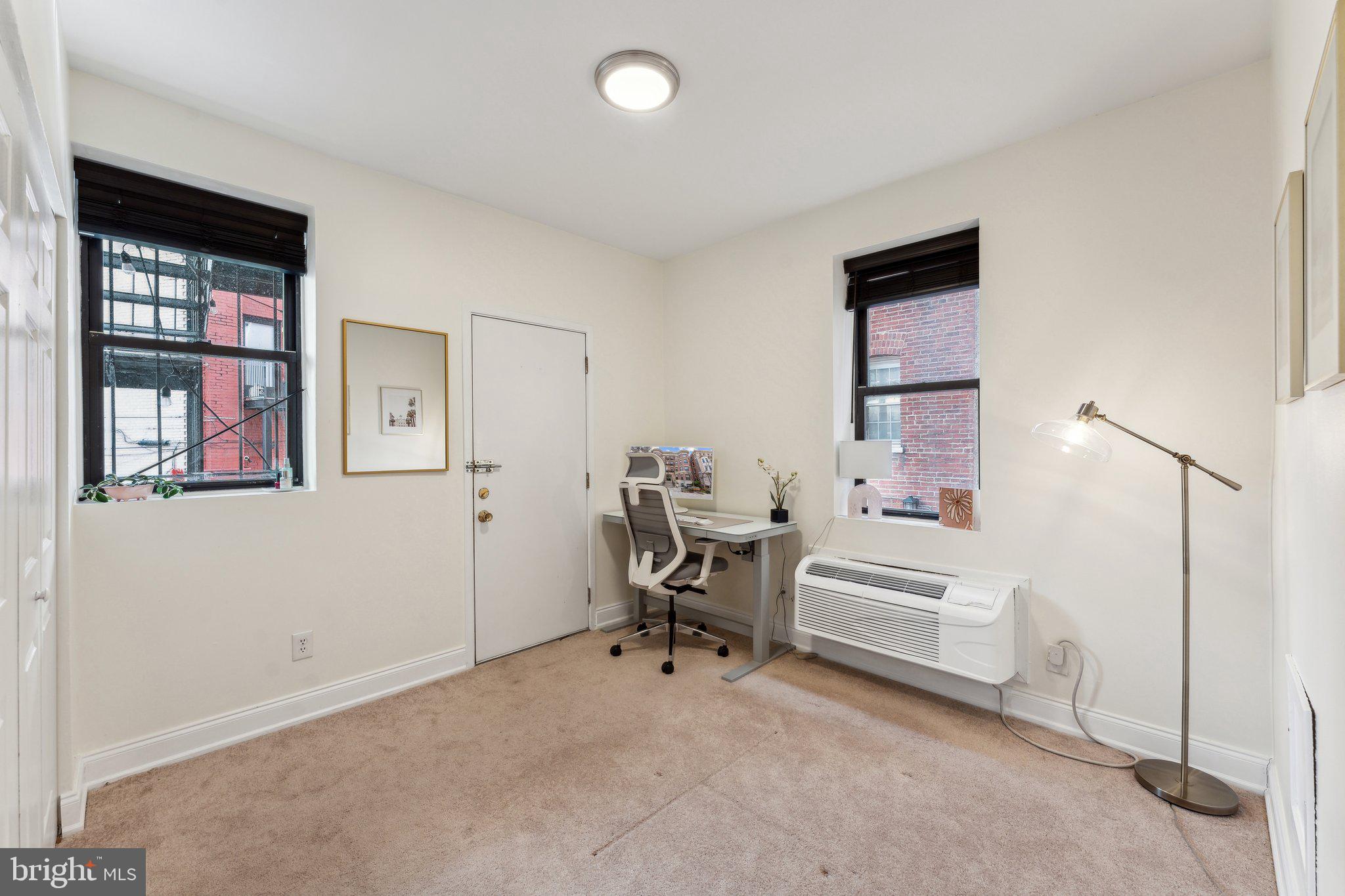 1844 Columbia Road Northwest, Unit 103 Washington, DC 20009 - Photo 6 of 21 a work room with furniture and windows