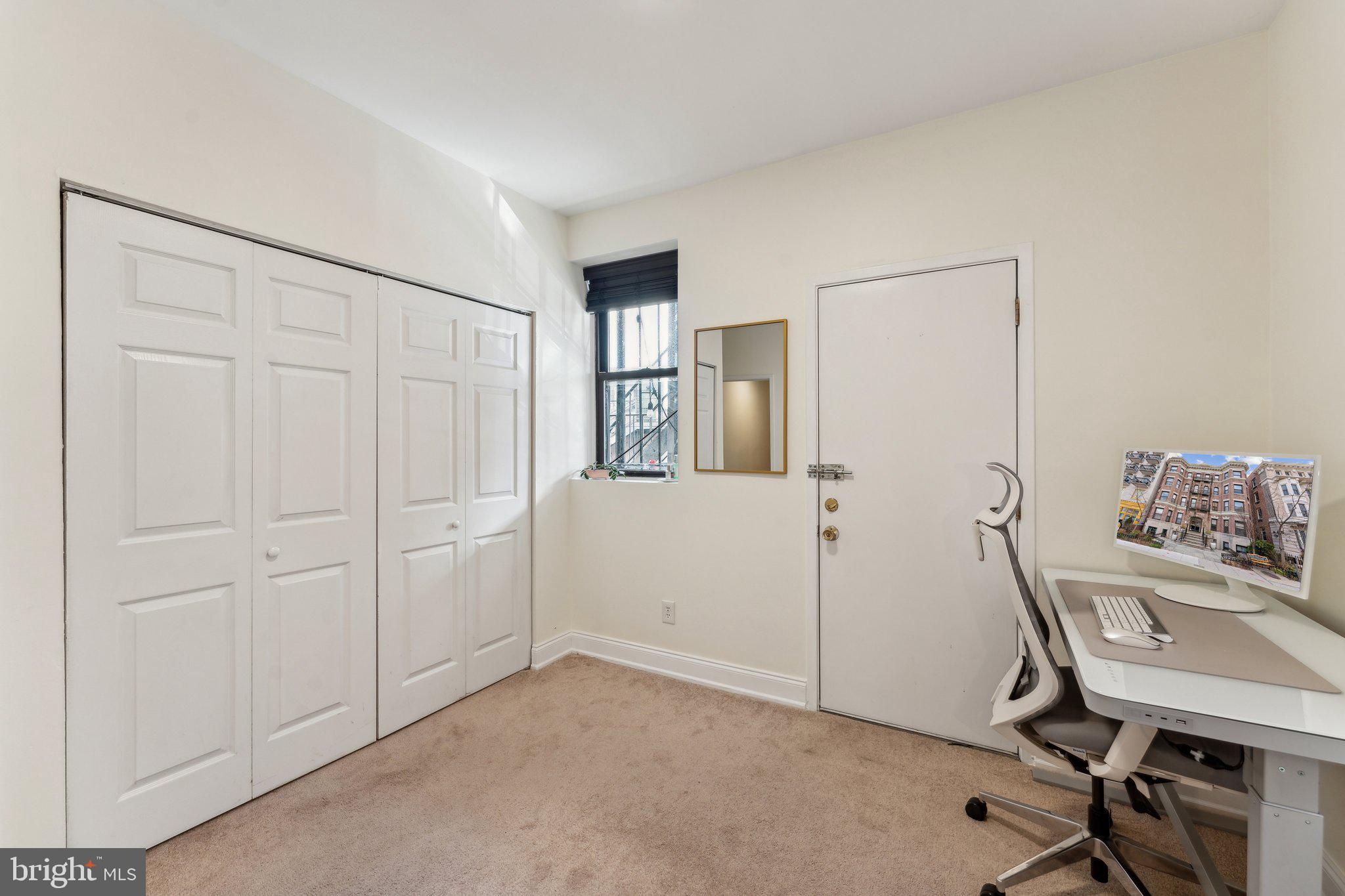 1844 Columbia Road Northwest, Unit 103 Washington, DC 20009 - Photo 7 of 21 a view of a workspace with furniture