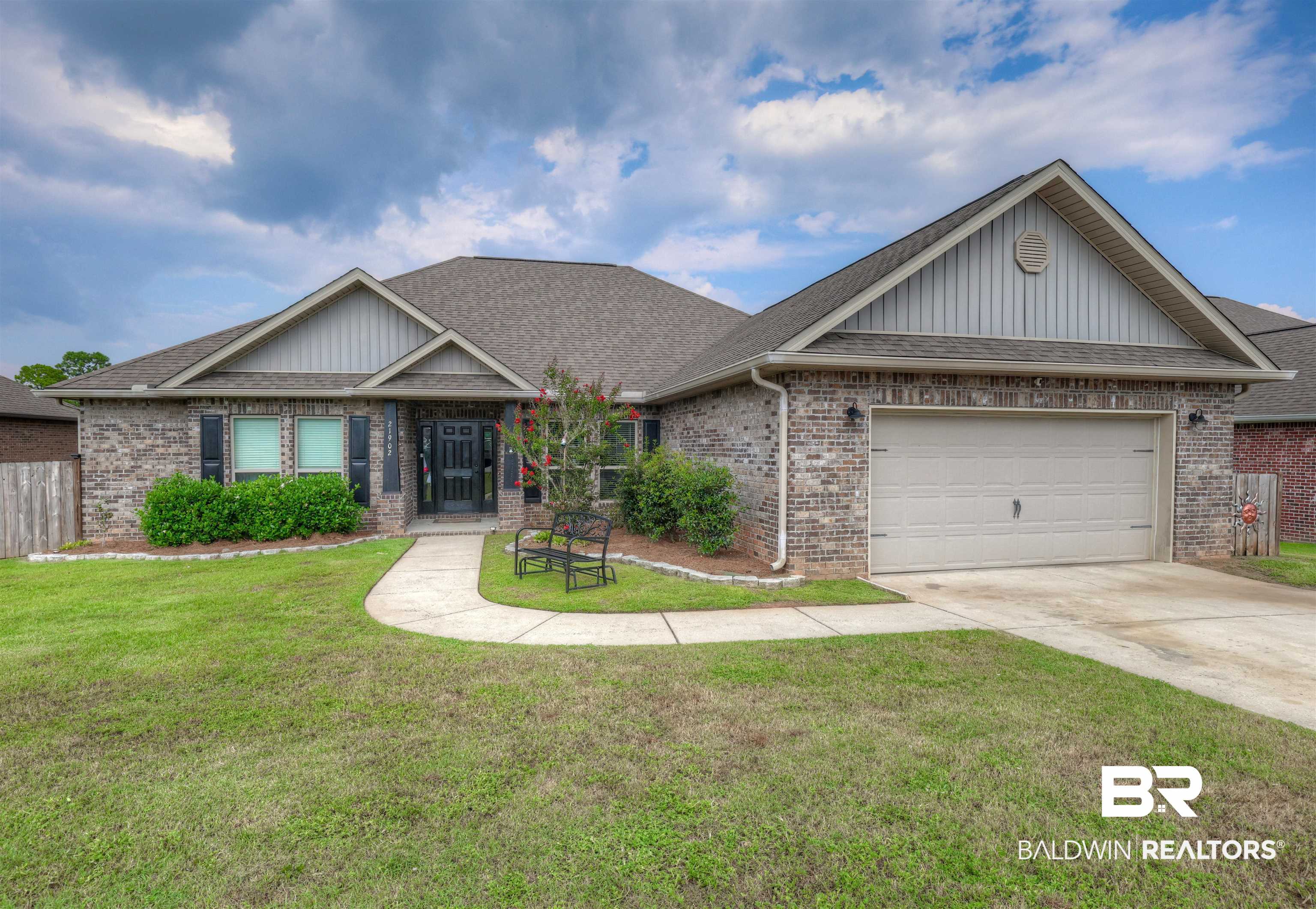 21902 Yosemite Boulevard Fairhope, AL 36532 - Photo 1 of 32 Craftsman-style home with a front yard and a garage
