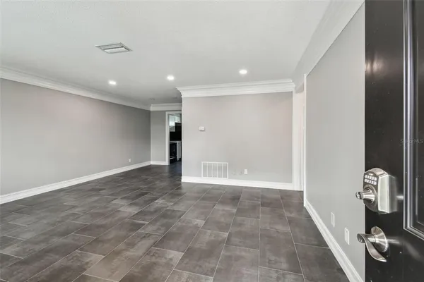 a view of an empty room with windows