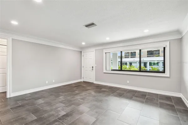 a view of an empty room with a window