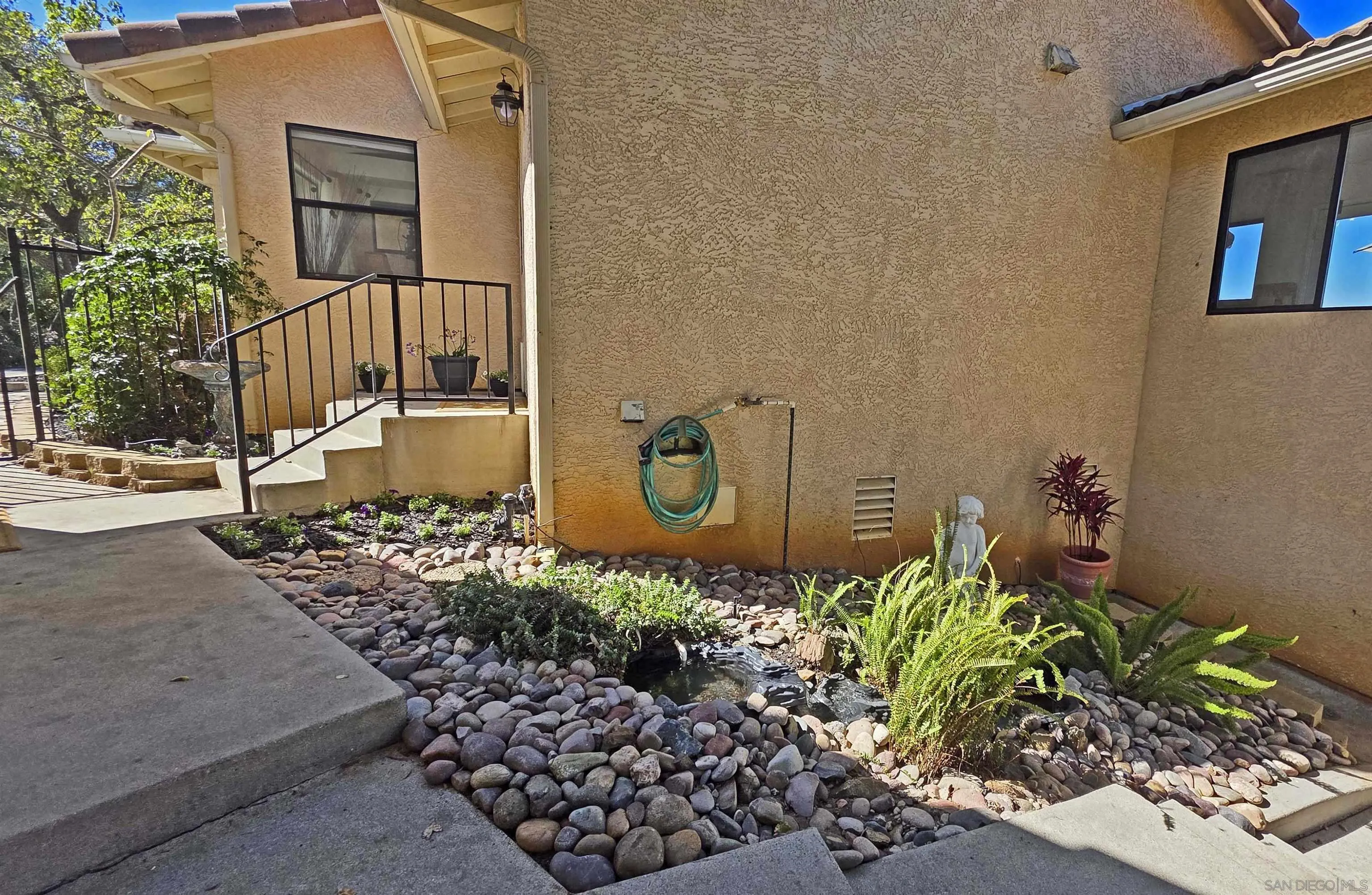 13588 McNally Road Valley Center, CA 92082 - Photo 36 of 43 a front view of a house with a yard