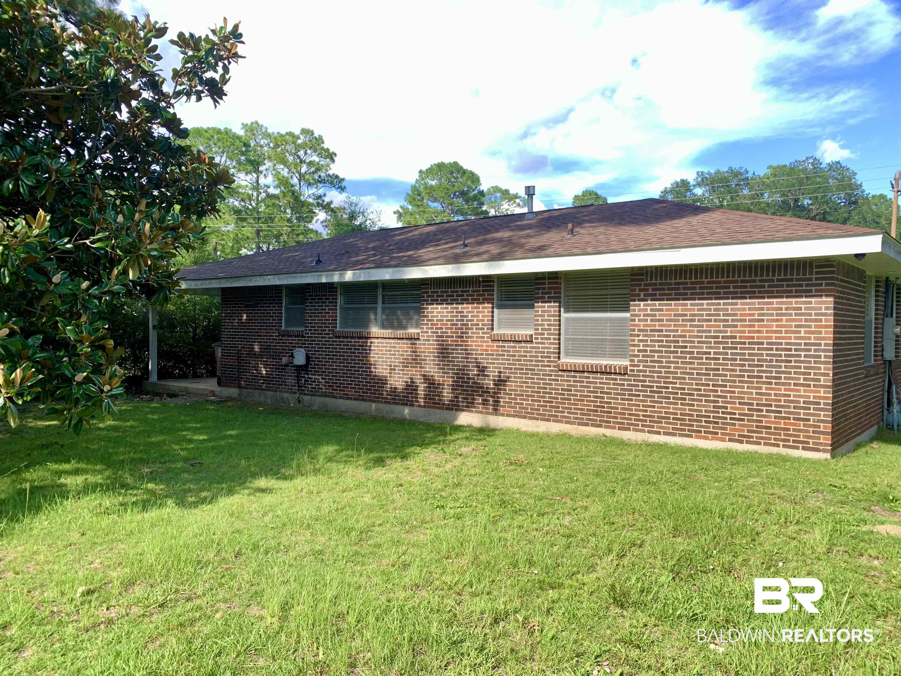 2710 West Road Mobile, AL 36693 - Photo 10 of 10 Rear view of property featuring a lawn