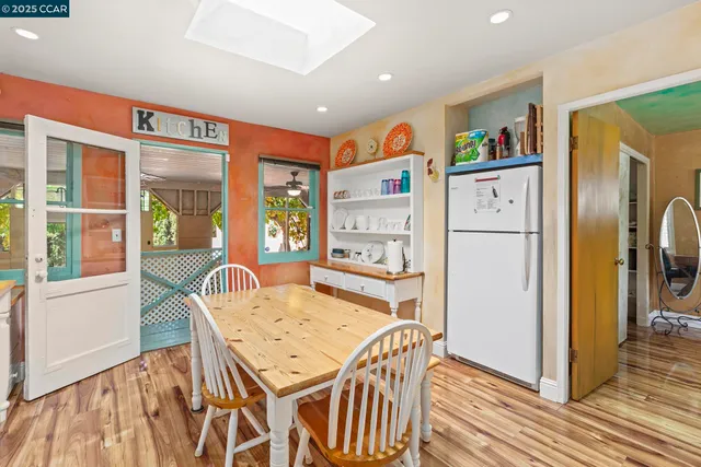 a dining room with a table and chairs