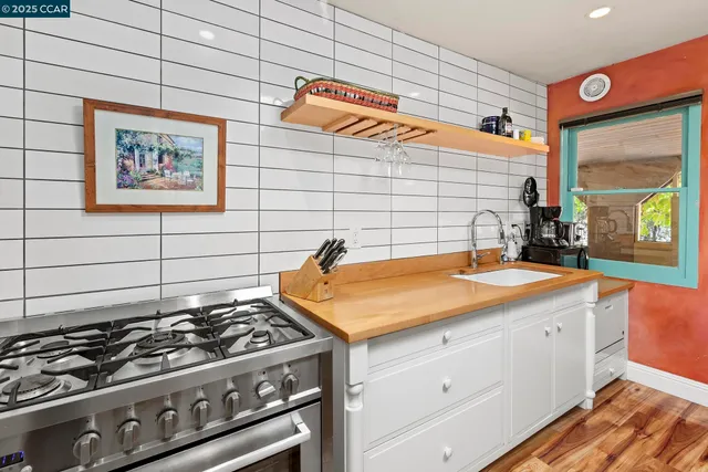 a dining room with furniture a rug and a chandelier
