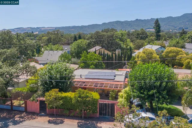 an aerial view of a house with a garden