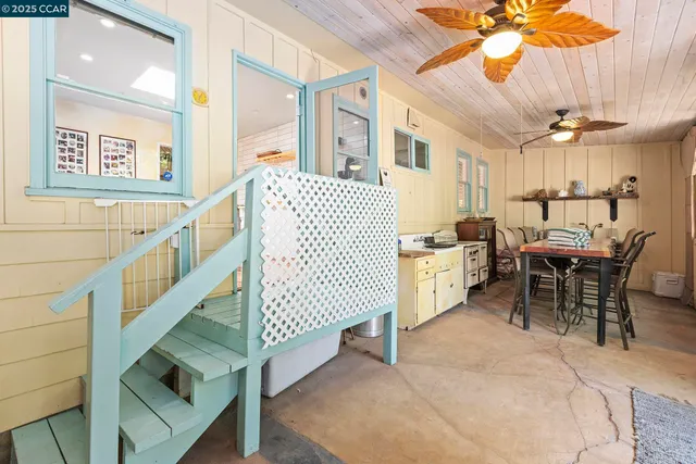 a view of a dining room with furniture window and outside view