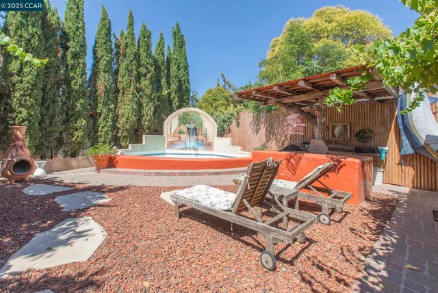 a view of a backyard with a patio