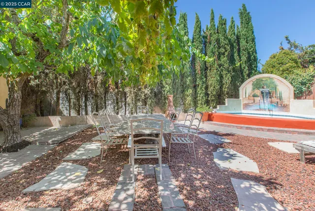 a view of a swimming pool with a lounge chairs