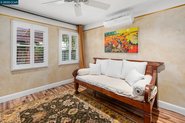 a view of a patio with table and chairs and potted plants