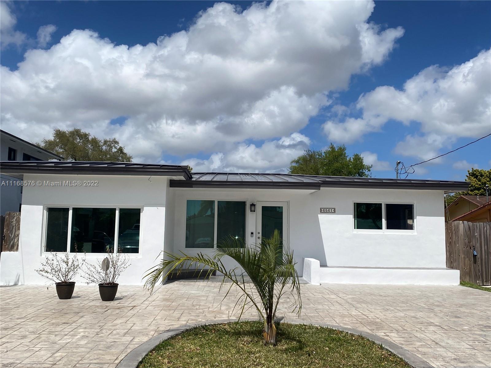a house view with a garden space