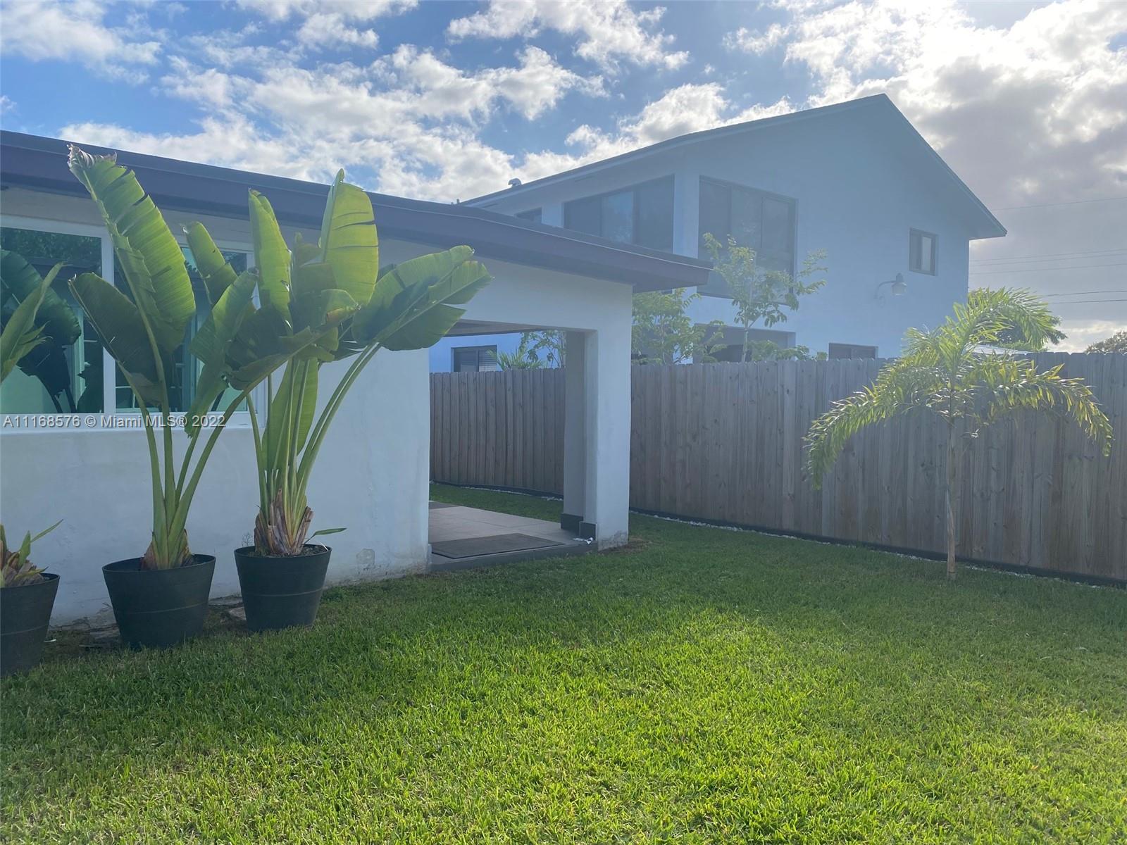 6561 Southwest 30th Street, Unit FRONT Miami, FL 33155 - Photo 15 of 18 a view of a backyard