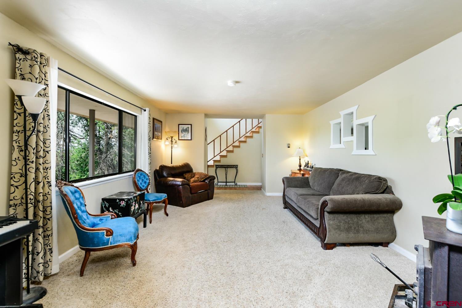 22247 H75 Road Delta, CO 81416 - Photo 13 of 35 a living room with furniture and a large window