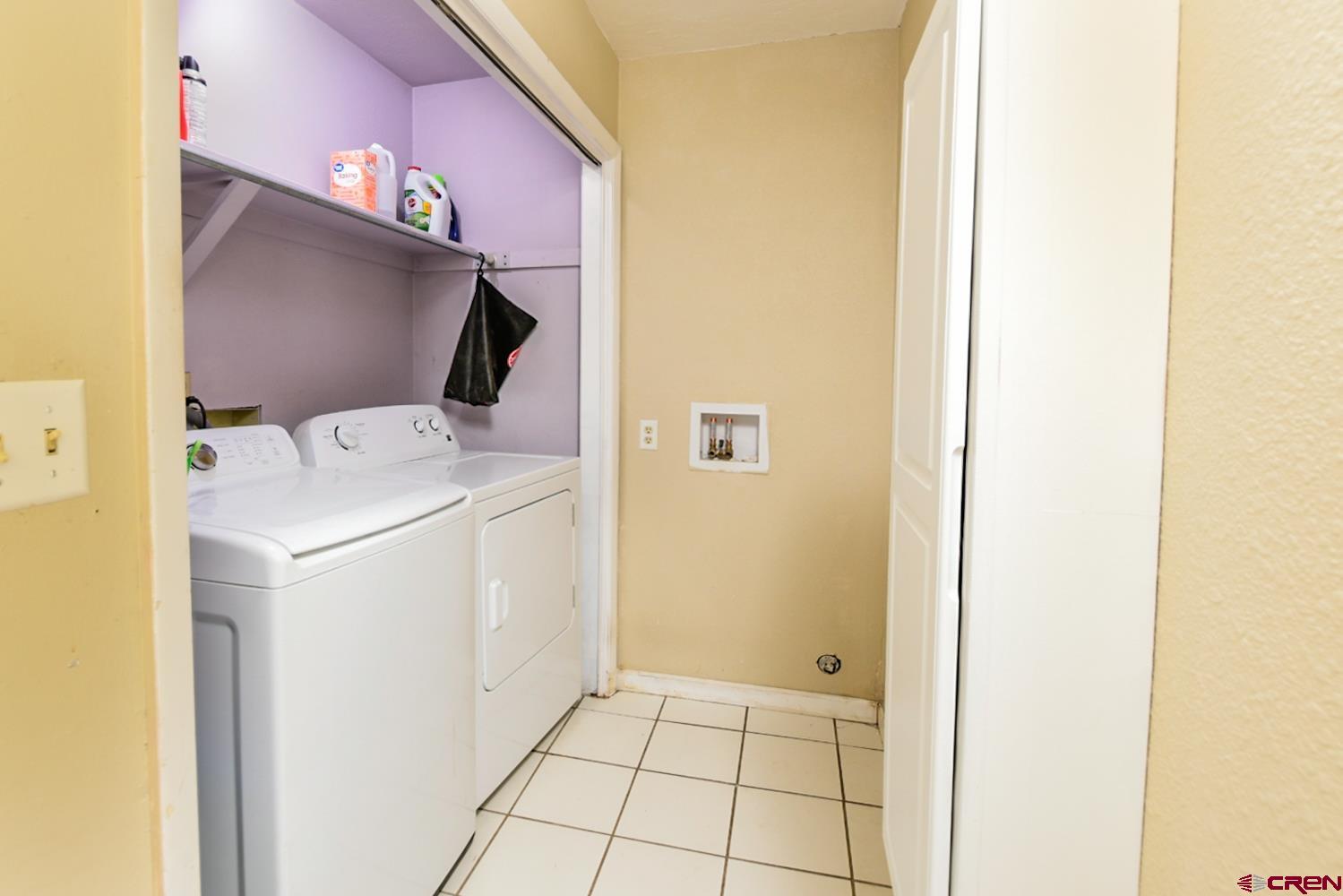 22247 H75 Road Delta, CO 81416 - Photo 19 of 35 a utility room with dryer and washer